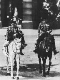 The Queen in uniform on horseback