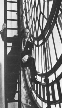 Dimbleby behind the clock face of what is popularly known as "Big Ben"