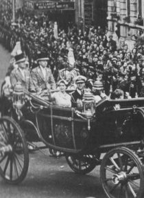 The Queen and the Duke of Edinburgh in an open carriage