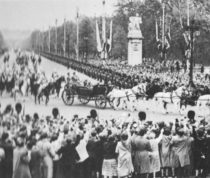 Crowds wave to the royal carriage
